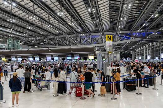 Bangkok, Thailand - April 10, 2023: Suvarnabhumi Airport with many travelers during the Songkran Festival because it is the Thai New Year which is a long holiday.There are many festivals in provinces.