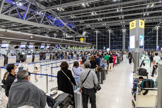 Bangkok, Thailand - April 10, 2023: Suvarnabhumi Airport with many travelers during the Songkran Festival because it is the Thai New Year which is a long holiday.There are many festivals in provinces.
