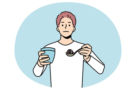 Portrait of young man have spoonful of pills with glass of water. Male patient hold spoon with medications suffer from drug or painkiller addiction. Healthcare and medicine. Vector illustration.