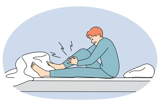Man wake up at night suffer from cramp massage leg. Unhealthy unwell guy awaken in bed struggle with sudden muscle strain or spasm at home. Healthcare concept. Vector illustration.