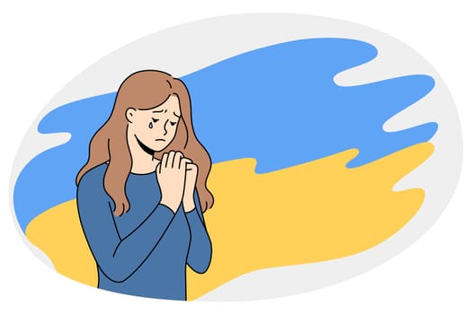 Unhappy girl on Ukraine flag background pray for saving lives of people in war. Upset young Ukrainian woman crying against war and Russian aggression. Fear and violence. Vector illustration.