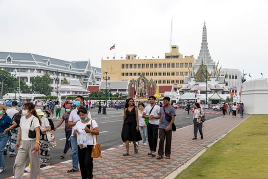 Bangkok,Thailand - April 16, 2023: Na Phra Lan Road is the road in front of Wat Phra Kaew. or the Grand Palace of Thailand Closed to traffic for a large number of tourists to walk around the place.