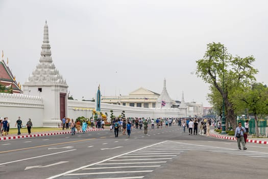 Bangkok,Thailand - April 16, 2023: Na Phra Lan Road is the road in front of Wat Phra Kaew. or the Grand Palace of Thailand Closed to traffic for a large number of tourists to walk around the place.