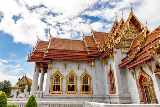 Wat Benchamabophit Dusit Wanaram (This temple is known as the Marble Temple) in Bangkok, blue sky and clouds. One of the most beautiful temples in Thailand Favorite destination in Bangkok. Daytime.