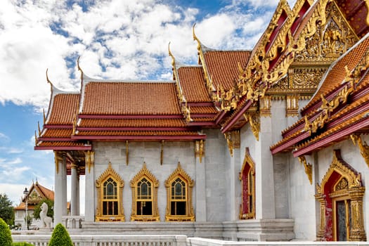 Wat Benchamabophit Dusit Wanaram (This temple is known as the Marble Temple) in Bangkok, blue sky and clouds. One of the most beautiful temples in Thailand Favorite destination in Bangkok. Daytime.