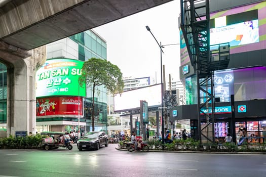 Bangkok, Thailand - Dec 8, 2022 : The exit for cars in the Siam Square area, famous shopping area of Bangkok. Surrounded by about 2,000 shops and restaurants. There is sky train over the road.