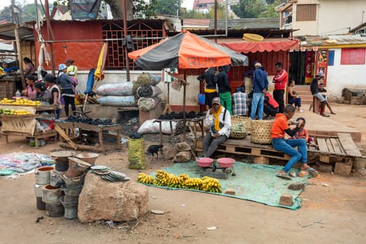 ANTANANARIVO, MADAGASCAR - OCTOBER 28, 2022: Street fruit vendors sell their goods by the roadside in Antananarivo, Madagascar