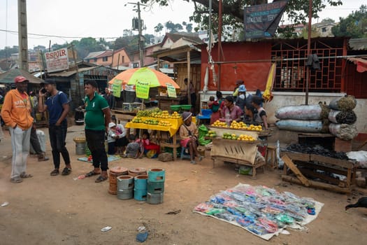 ANTANANARIVO, MADAGASCAR - OCTOBER 28, 2022: Street fruit vendors sell their goods by the roadside in Antananarivo, Madagascar