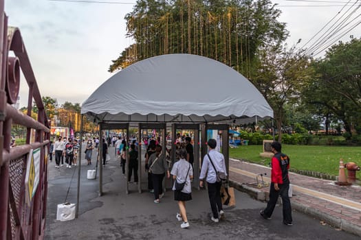 Bangkok, Thailand - Dec 8, 2022 :People have to walk through metal detectors. For safety in organizing the Red Cross Fair Held between December 8-18, 2022 at Lumpini Park after 2 years of suspension.