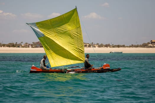 NOSY ISLAND, MADAGASCAR - NOVEMBER 22, 2022: Fishermen using sailboats to fish off the coast of Nosy Island in Madagascar. The primary source of livelihood in Anakao is fishing.