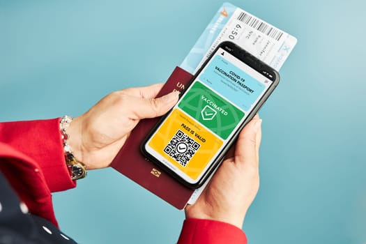 Digital covid certificate. Covid vaccination digital pass. Woman passenger holding digital medical pass on her mobile phone, passport and airplane ticket. Traveler showing digital covid test result as medical pass for travel during covid-19 pandemic