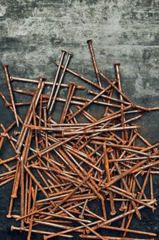Rusty nails on steel surface. Tools for maintenance. Hardware tools to fix. Technical background with copy space