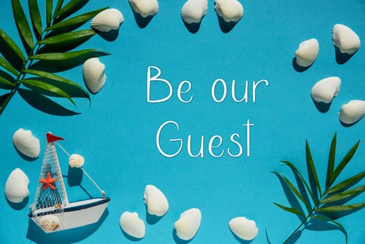 Flat Lay With English Text Be Our Guest. Turquoise Or Blue Background With Maritime Decoration Like Boat, Shells And Palm Leaf.