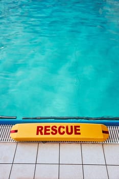 Lifesaver equipment on swimming pool. Candid people, real moments, authentic situations