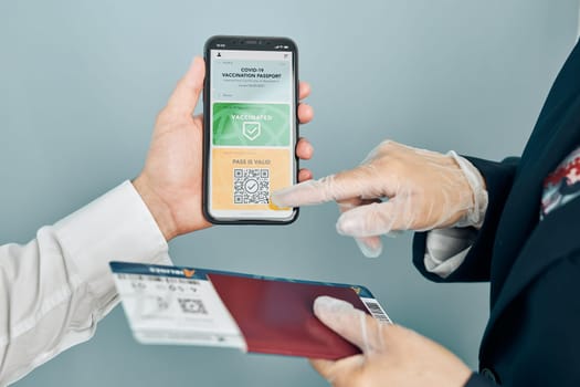 Digital covid certificate. Covid vaccination digital pass. Woman passenger holding digital medical pass on her mobile phone, passport and airplane ticket. Traveler showing digital covid test result as medical pass for travel during covid-19 pandemic