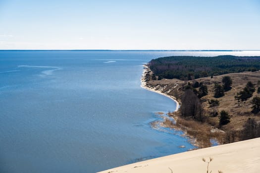 Baltic sea from Curonian Spit. The Gray Dunes, or the Dead Dunes is sandy hills with a bit of green specks at the Lithuanian side of the Curonian Spit.