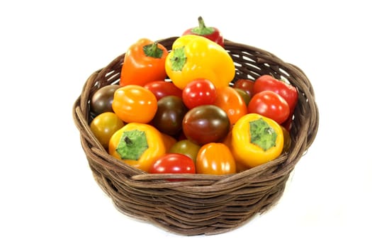 Tomatoes and peppers in a small basket