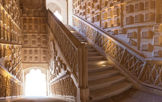 Valladolid Spain - July 18th 2020: San Gregorio College indoor stairs. Visitor woman taking pictures. Valladolid Spain
