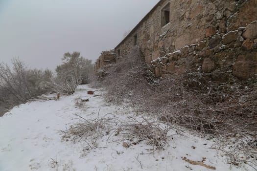 Old house in ruins in the mountains, lots of snow in the north of Portugal
