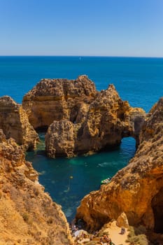 Lagos, Portugal - 25 August 2025: Tourists visiting Ponta da Piedade, in Lagos. Algarve, Portugal