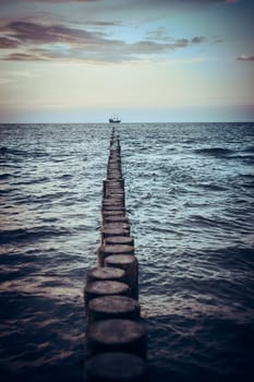 Beautiful sunset over sea horizon. Soft colors, mood and magic, subtle light. Small clouds in the sky. Concept of romantic summertime and vacation