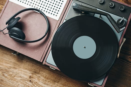 Listening to music from vinyl record. Playing music from analog disk on turntable player. Enjoying music from old collection. Relaxing at home. Retro and vintage. Audio stereo equipment. Analog sound