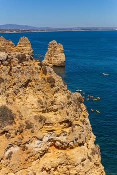 Lagos, Portugal - 25 August 2025: Tourists visiting Ponta da Piedade, in Lagos. Algarve, Portugal