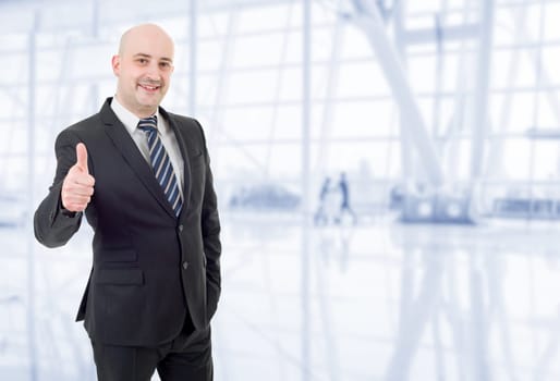 young business man going thumb up, at the office