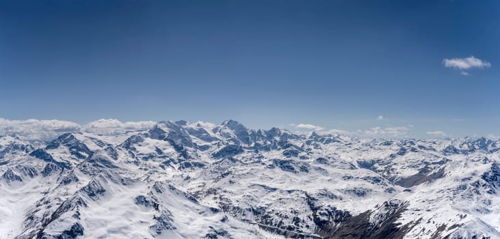 aerial landscape, from a glider plane, of Bernina range, shot from east in bright late spring light, Poschiavo, Switzerland