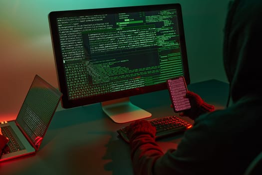 Anonymous people using computer and programming to break code. Cyber security threat. Internet and network security. Access to private information. Anonymous hackers using technology to access to password and encrypted data. Cyber attack