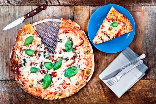 Fresh pizza on wooden table