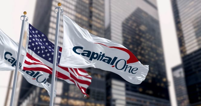New York, US, April 2023: Capital One bank flags waving in a financial district. Capital One Q1 2023 profit missed estimates due to provisions. Illustrative editorial 3d illustration
