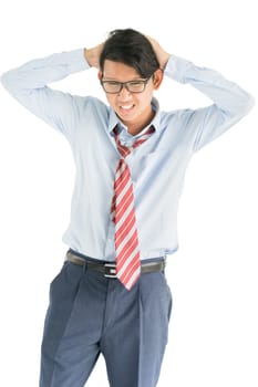 Young man  wearing blue shirt and red tie touching his temples and having headache isolated on white background