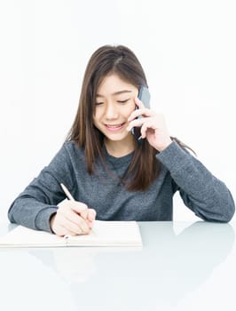 Woman long hair Woman using mobile phone and  writing notebook on white background