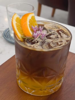 A glass of iced black orange coffee, stock photo