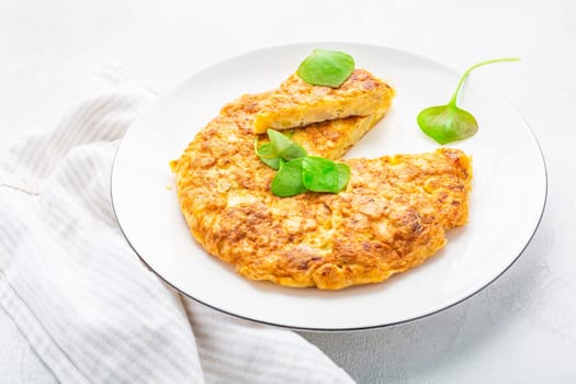 Spanish omelet (Tortilla de patatas) with potatoes and onion, typical Spanish cuisine.