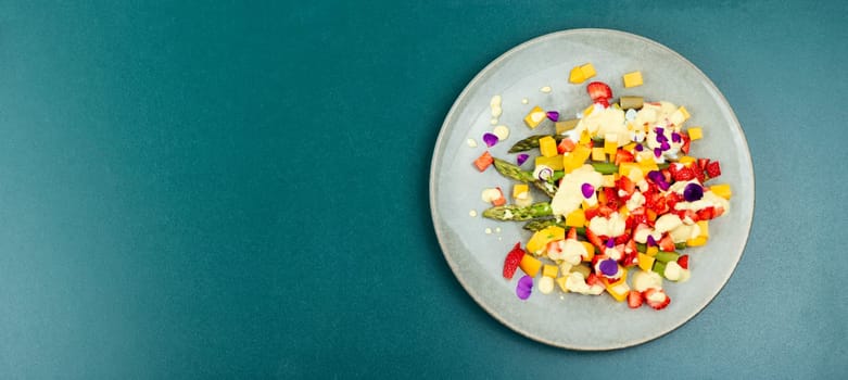 Colorful healthy salad with spice, strawberries, yogurt and mango. Copy space. Banner.
