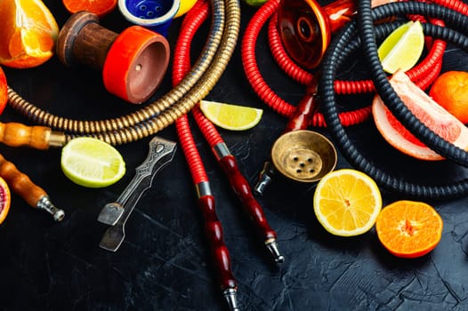 Smoking relax hookah with tobacco. The pleasure of smoking. Oriental shisha and fruits.