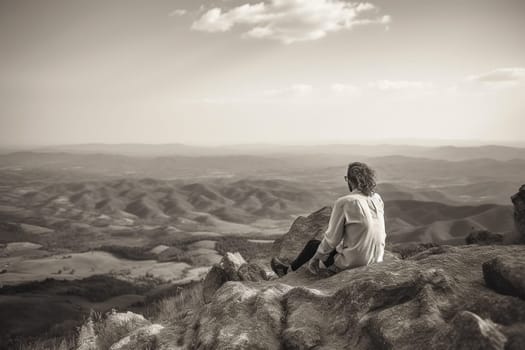 The couple sits together on the mountain peak, overlooking the beautiful landscape below. The majesty of the natural world is on full display, with the couple basking in the serene beauty of their surroundings. The monochrome adds to the romantic and peaceful aspect of the scene, creating a sense of unforgettable intimacy in the midst of vast, endless beauty. (generative AI)