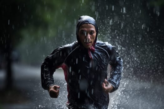 A person runs energetically through the rain, without an umbrella, soaking wet from head to toe. The scene is dynamic and lively, with the rain creating a high contrast atmosphere. The refreshing coldness of the rain and the freedom of running create a natural rhythm in the mind and body, wiping away stress and daily concerns. This scene can evoke feelings of freedom, energy, and mental clarity. (generative AI)