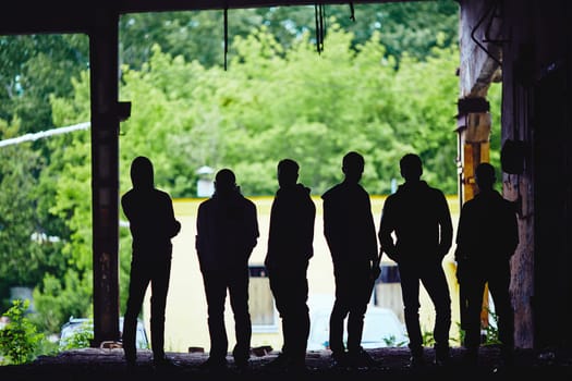 Outlines of gangster team outside