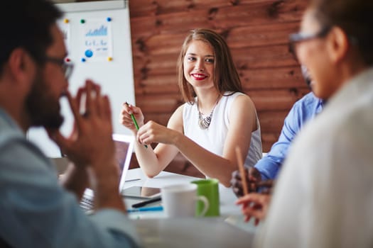 Happy manager looking at colleague during conversation