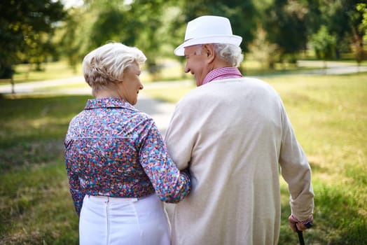 Rear view of senior couple taking a walk