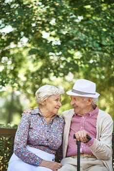 Senior couple in smart casual interacting in urban environment