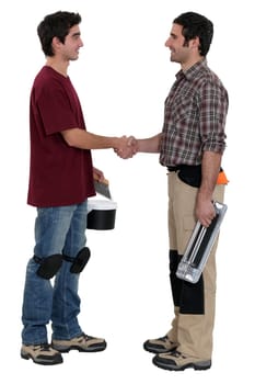 Workers shaking hands