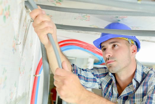 Electrician wiring a new house