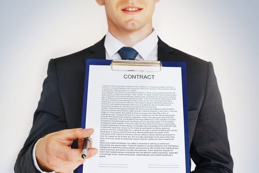Businessman with contract giving pen to partner to sign it