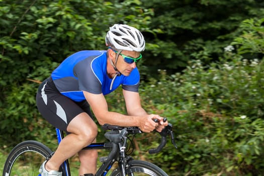 Triathlete cycling,male,45 years