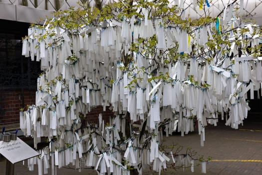 The Hague  Netherlands - April 17  2023: The wishing tree in front of Peace Palace inThe Hague  Netherlands  which houses the International Court of Justice