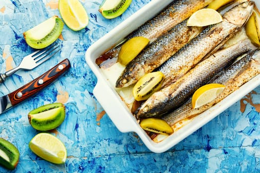 Delicious grilled fish with kiwi and lime sauce on a plate